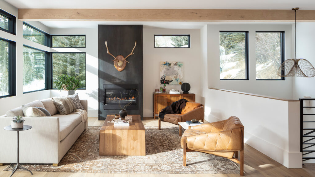 RootsBNB Canmore living room, with a fireplace, cozy living room, and modern floor rug.